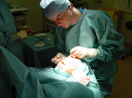 Mr Richard Caesar operating on a patient